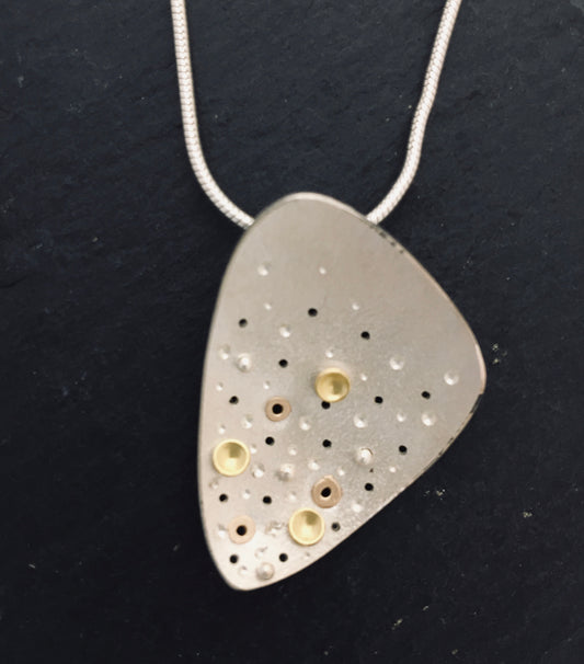 Gold and silver pendant